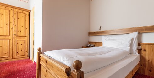 Bett im Einzelzimmer Hotel Arosa
